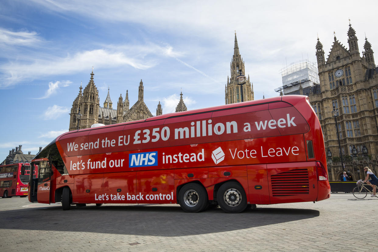 LONDON, ENGLAND - JULY 18: A 'Vote LEAVE' battle bus is parked outside the Houses of Parliament in Westminster by the environmental campaign group Greenpeace before being re-branded on July 18, 2016 in London, England. The bus which was used during the European Union (EU) referendum campaign and had the statement "We send the EU £350 million a week let's fund our NHS instead" along the side was today covered with thousands of questions for the new Prime Minister Theresa May and her government about what a 'Brexit' might mean for the environment. (Photo by Jack Taylor/Getty Images)