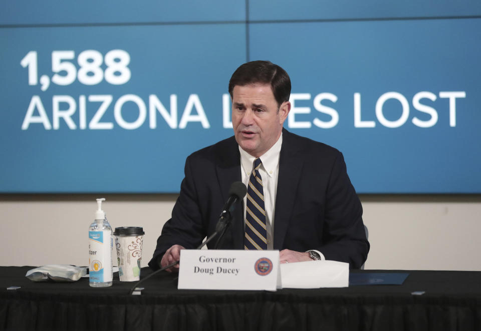 Arizona Gov. Doug Ducey updates reporters on COVID-19 in the state, during a news conference in Phoenix on Monday, June 29, 2020. Ducey ordered bars, nightclubs and water parks to close again for at least a month starting Monday night — a dramatic about-face as coronavirus cases surge in the Sunbelt. (Michael Chow/The Arizona Republic via AP, Pool)