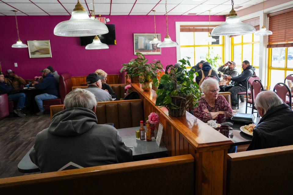 Customers eat American and Mexican food at Cronk's Café during a recent Friday lunch rush.