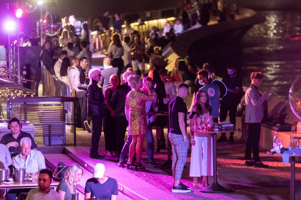 Patrons are seen at the Opera Bar during New Year's Eve celebrations on December 31, 2020 in Sydney.