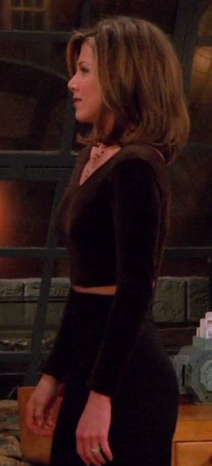screenshot of rachel wearing high-waisted pants with a dark long sleeve crop top