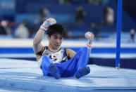 Kohei Uchimura, of Japan, falls from the horizontal bar during the men's artistic gymnastic qualifications at the 2020 Summer Olympics, Saturday, July 24, 2021, in Tokyo. (AP Photo/Natacha Pisarenko)