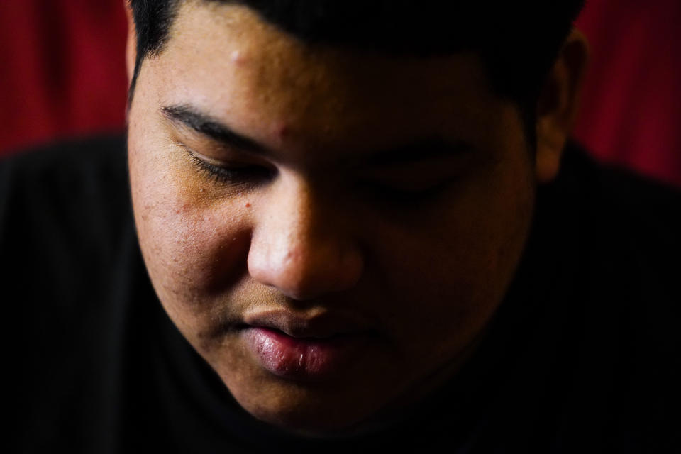 Erick Zuniga Gonzales, 17, speaks during an interview with The Associated Press in the Kensington section of Philadelphia, Sunday, May 16, 2021. Gonzales and his brother are trying to rebuild their lives together with their mother Keldy Mabel Gonzales Brebe, a 37-year-old Honduran immigrant, after they were separated under a former "zero-tolerance" policy to criminally prosecute adults who entered the country illegally. (AP Photo/Matt Rourke)