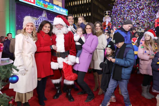 From left: Dana Perino, Jeanine Pirro, a man dressed as Santa Claus, Jesse Watters and Jessica Tarlov pose during the FOX News Christmas tree lighting ceremony on Nov. 21 in New York City.