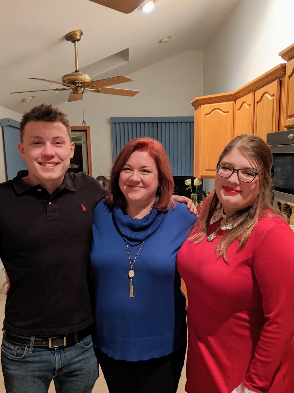 The English family of Maple Shade is coping with the loss of their house and dog from a Christmas Day fire. From the left are Peter, mother Kim and daughter Jessica.