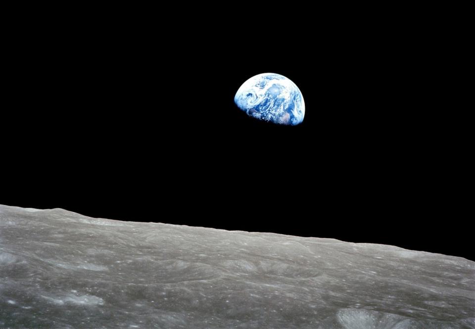 The famous "Earthrise" photo taken by Apollo 8 astronaut Bill Anders on Dec. 24, 1968. The sunset terminator is seen crossing Africa. <cite>NASA/Bill Anders</cite>