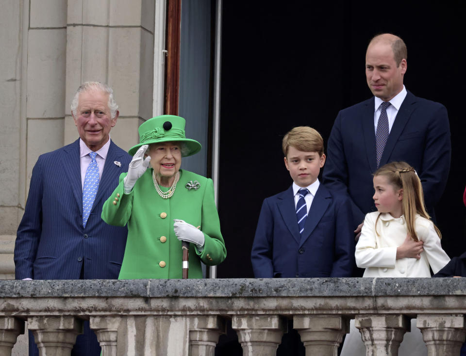 From left, Britain's Prince Charles, Queen Elizabeth II, Prince George, Prince William and Princess Charlotte on the balcony during the Platinum Jubilee Pageant outside Buckingham Palace in London, Sunday June 5, 2022, on the last of four days of celebrations to mark the Platinum Jubilee. The pageant will be a carnival procession up The Mall featuring giant puppets and celebrities that will depict key moments from the Queen Elizabeth II’s seven decades on the throne. (Jonathan Buckmaster/Pool Photo via AP)