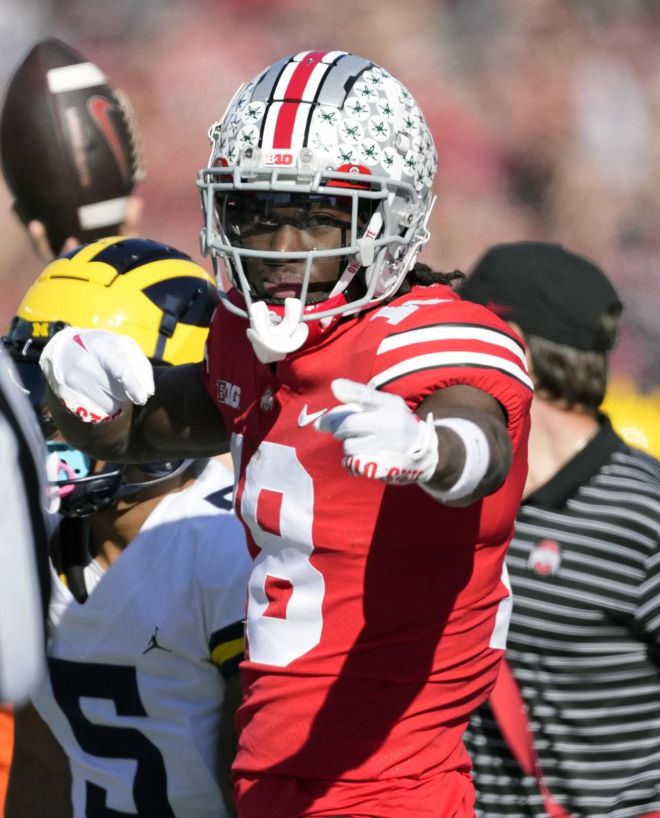 Nov 26, 2022; Columbus, OH, USA; Ohio State Buckeyes wide receiver Marvin Harrison Jr. (18) points to a first down after a catch against Michigan Wolverines in the first quarter of their game at Ohio Stadium. 