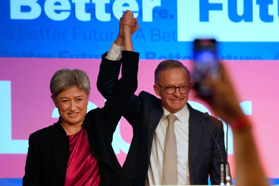 Labour Party leader Anthony Albanese, right, celebrates with a Labour senator (Rick Rycroft/AP) (AP)