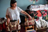 Dorina Hanza, a 52-year-old embroiderer, was among those in Romania who cottoned on to the similarity between the traditional folk waistcoat and the Dior version