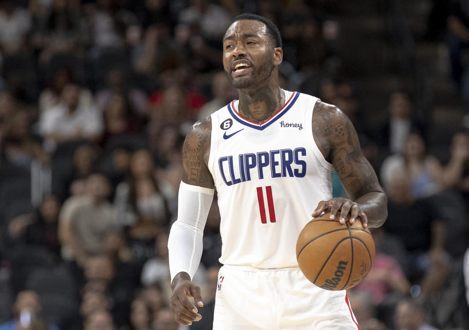 Los Angeles Clippers guard John Wall (11) calls a play during the second half of an NBA basketball game against the San Antonio Spurs, Friday, Nov. 4, 2022, in San Antonio. (AP Photo/Nick Wagner)