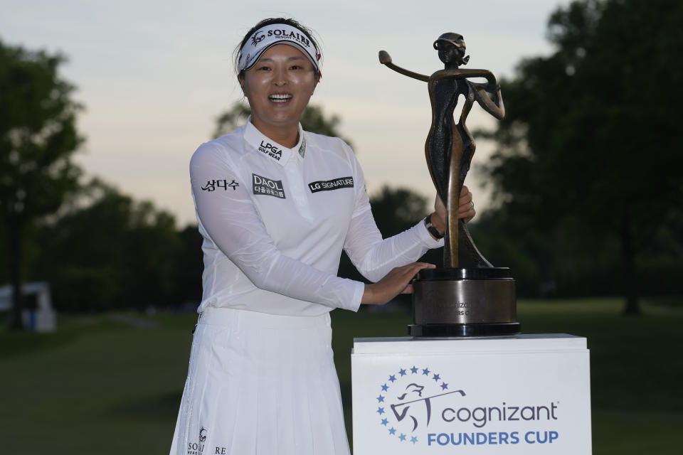 Jin Young Ko, of South Korea, poses for a photoe with the trophy after winning the LPGA Cognizant Founders Cup golf tournament in a playoff, Sunday, May 14, 2023, in Clifton, N.J. (AP Photo/Seth Wenig)