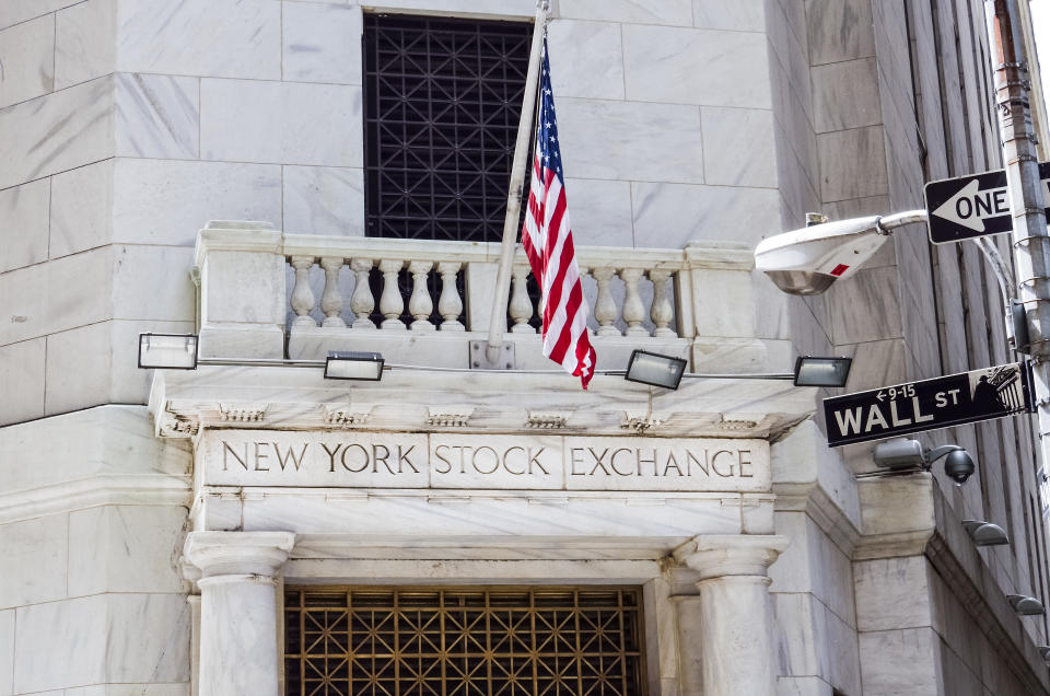 New York, United States - June 18, 2016: New York Stock Exchange with American flags and Wall street sign