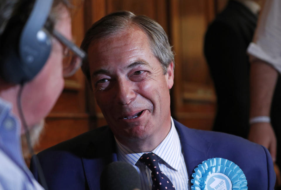 Brexit Party leader Nigel Farage is interviewed after the results were announced at the counting center for the European Elections for the South East England region, in Southampton, England, early Monday, May 27, 2019. (AP Photo/Alastair Grant)