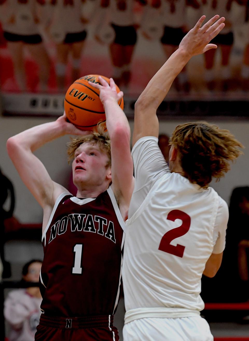 Nowata High School's senior Kaleb Bashford (1) scores during basketball action earlier in the season.