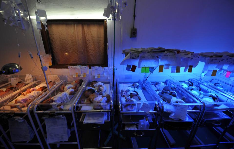 This photo taken on August 4, 2010 shows newly-born babies inside the nursery room of a government-run maternity hospital in Manila.  Photographer: Ted Aljibe/AFP/Getty Images