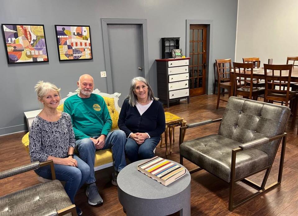 Founding resident artists of Market Street Art Spot are shown at the relocated and expanded gallery in downtown Minerva. They are, from left, Laura Donnelly, Marty Chapman and Michelle Mulligan.