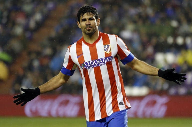 Atletico Madrid's Brazilian forward Diego Costa celebrates after scoring during the Spanish league football match Real Valladolid CF vs Atletico de Madrid at Jose Zorilla stadium in Valladolid on February 17, 2012. Atletico Madrid moved back to within 12 points of Barcelona at the top of La Liga with a comfortable 3-0 win