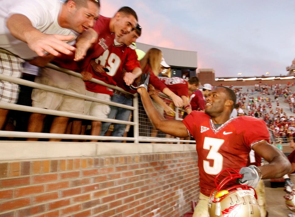 Oct 25, 2008; Tallahassee, FL, USA; Florida State safety Myron Rolle (3) celebrates with fans in the stands after the Seminoles defeated the Hokies 30-20 at Doak Campbell Stadium in Tallahassee, Florida.