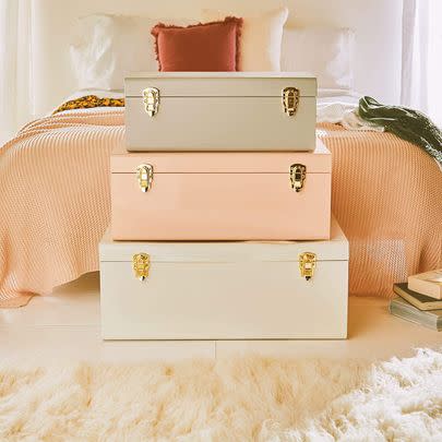 Keep linens and towels in statement storage trunks