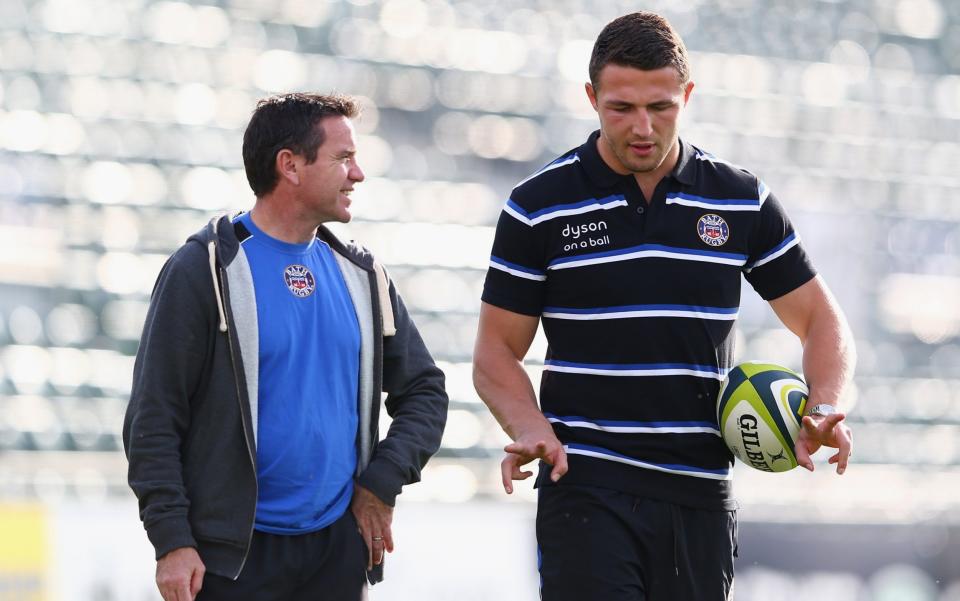  Sam Burgess (R) the new signing for Bath Rugby in conversation with Head Coach Mike Ford (L) during a Bath training session at the Recreation Ground on October 31, 2014 - Michael Steele/Getty Images