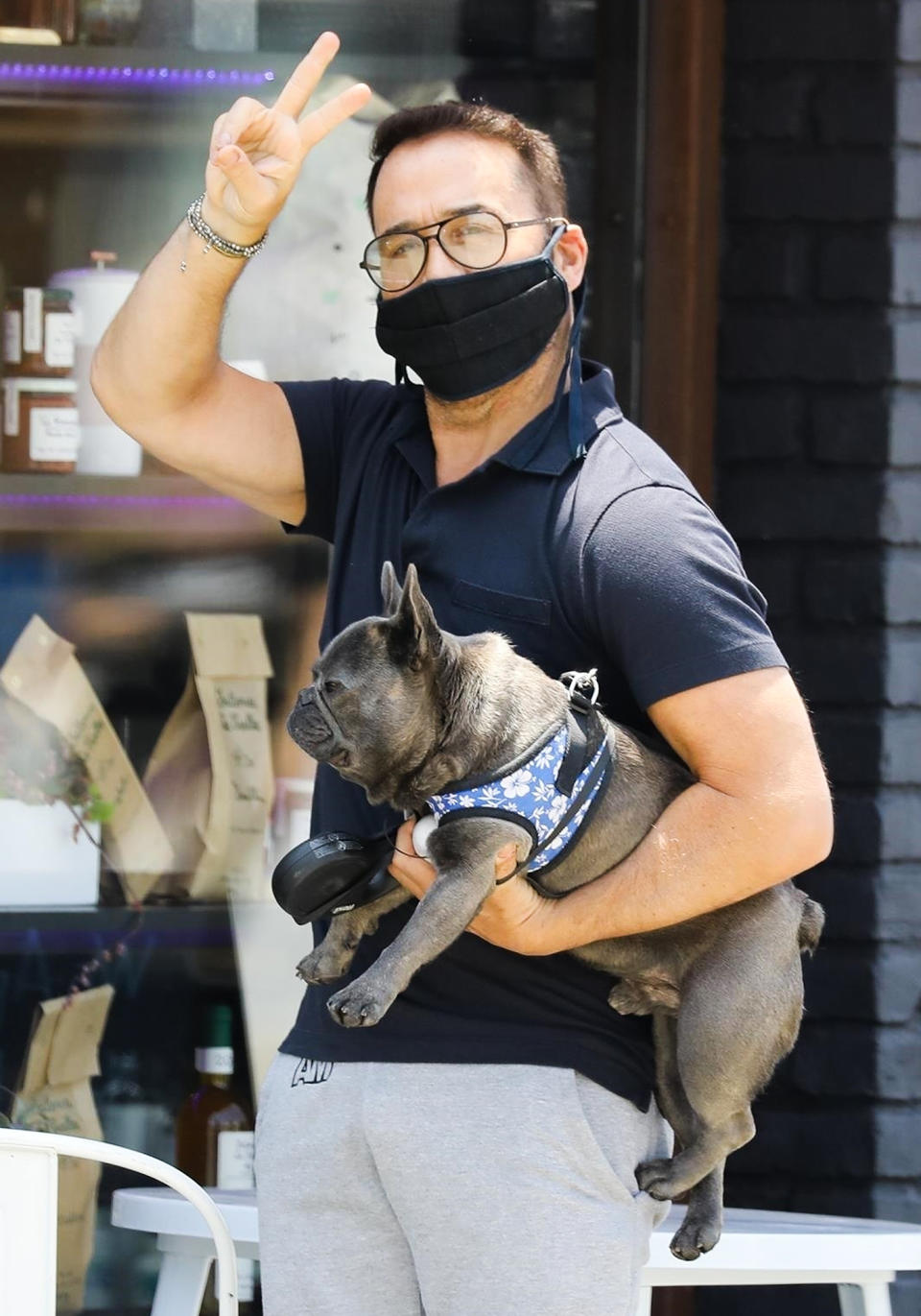 <p>Jeremy Piven totes his pooch Bubba during a stroll through West Hollywood on Monday.</p>