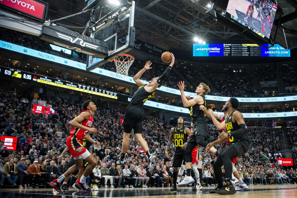 Utah Jazz center Walker Kessler (24) pulls in a rebound against the New Orleans Pelicans in the second half during an NBA basketball game Tuesday, Dec. 13, 2022, in Salt Lake City. (AP Photo/Isaac Hale)