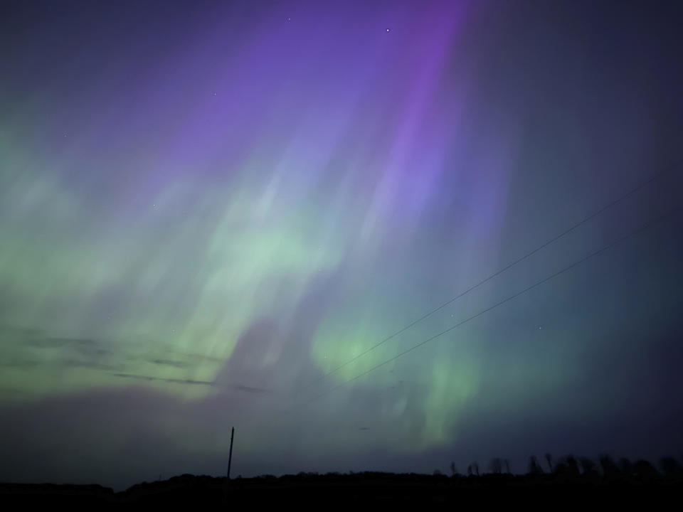 Northern lights glow in the sky near Kroschel, Minn., late Friday, May 10, 2024. / Credit: Owen Caputo Sullivan / AP