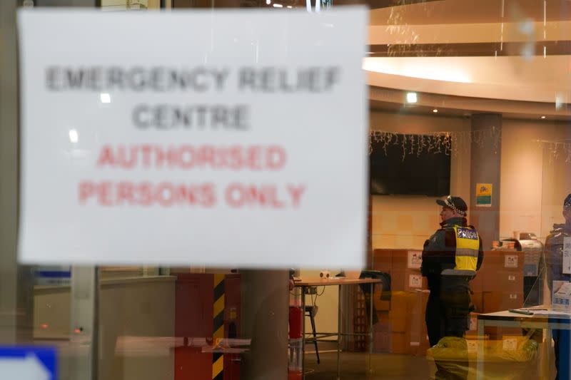 Police officers meet inside an emergency relief centre outside a locked down public housing tower in response to a COVID-19 outbreak in Melbourne