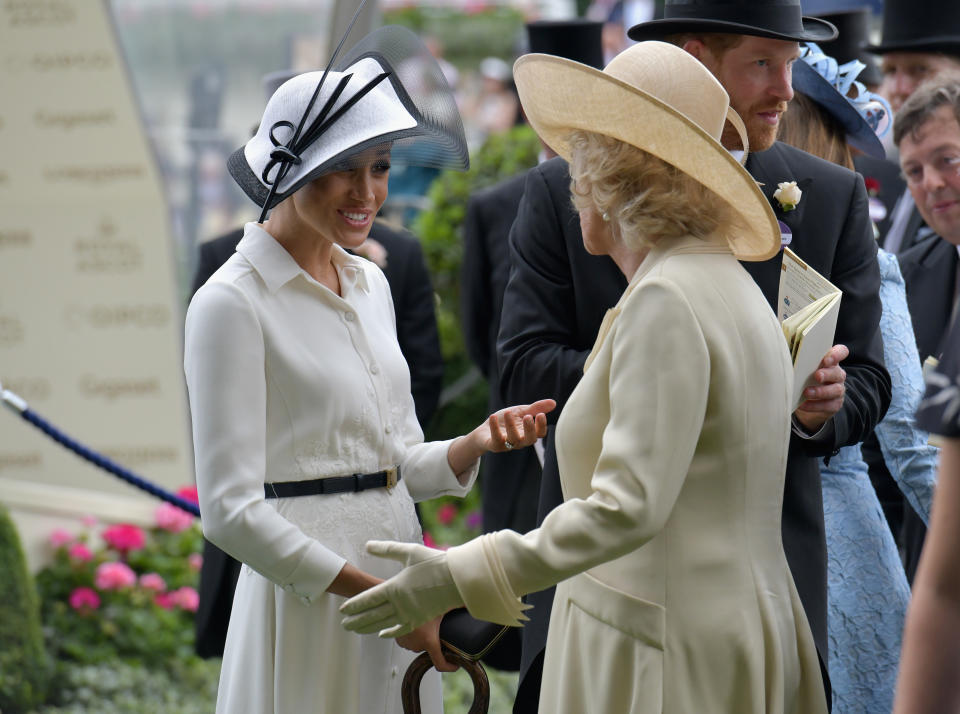 ASCOT, ENGLAND - JUNE 19:  (L-R)  Meghan Duchess of Sussex, Camilla Duchess of Cornwall  and Prince Harry, Duke of Sussex arrive on day 1 of Royal Ascot at Ascot Racecourse on June 19, 2018 in Ascot, England.  (Photo by Kirstin Sinclair/Getty Images for Ascot Racecourse)