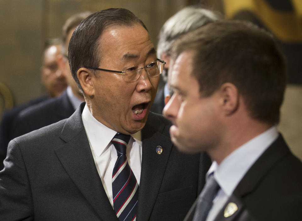 FILE - In this Tuesday, Jan. 21, 2014 file photo made by Associated Press photographer Anja Niedringhaus, United Nations Secretary-General Ban Ki-moon, left, reacts as he arrives for the conference on Disarmament at the United Nations headquarters in Geneva, Switzerland. Niedringhaus, 48, an internationally acclaimed German photographer, was killed and AP reporter Kathy Gannon was wounded on Friday, April 4, 2014 when an Afghan policeman opened fire while they were sitting in their car in eastern Afghanistan. (AP Photo/Anja Niedringhaus, File)