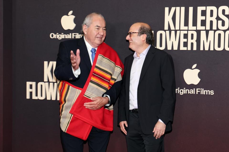 NEW YORK, NEW YORK - SEPTEMBER 27: Osage Nation Principal Chief Geoffrey Standing Bear (L) and David Grann attend Apple's "Killers of the Flower Moon" New York premiere at Alice Tully Hall, Lincoln Center on September 27, 2023 in New York City. (Photo by Dia Dipasupil/Getty Images) 1705053969