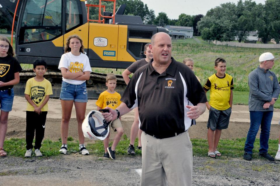 Waynedale Superintendent Jon Ritchie talks to people at the groundbreaking for the new K-12 school building.