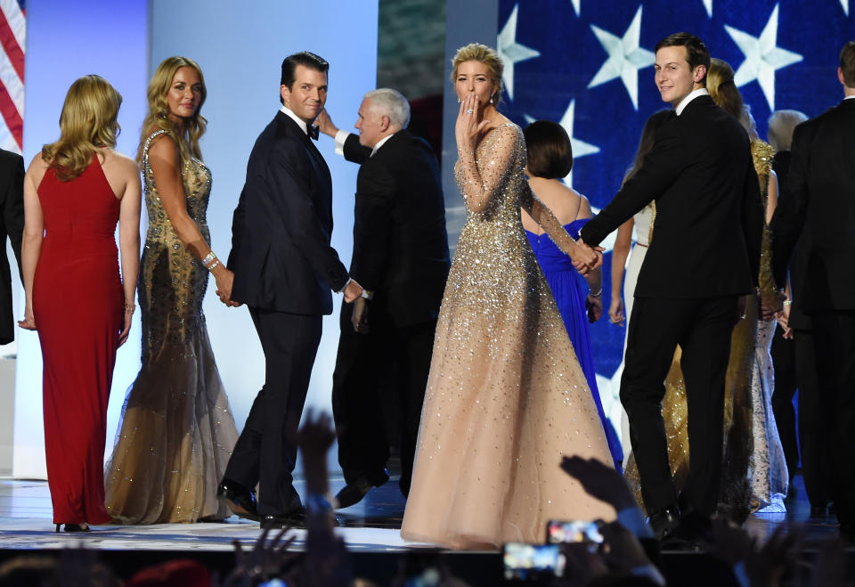 Ivanka Trump (C) blows a kiss to the crowd as she leaves the stage with her husband Jared Kushner (R) and her brother Donald Trump Jr and his wife Vanessa Trump, after dancing on stage during the Freedom ball at the Walter E. Washington Convention Center on January 20, 2017 in Washington, DC.  / AFP / Robyn BECK        (Photo credit should read ROBYN BECK/AFP via Getty Images)