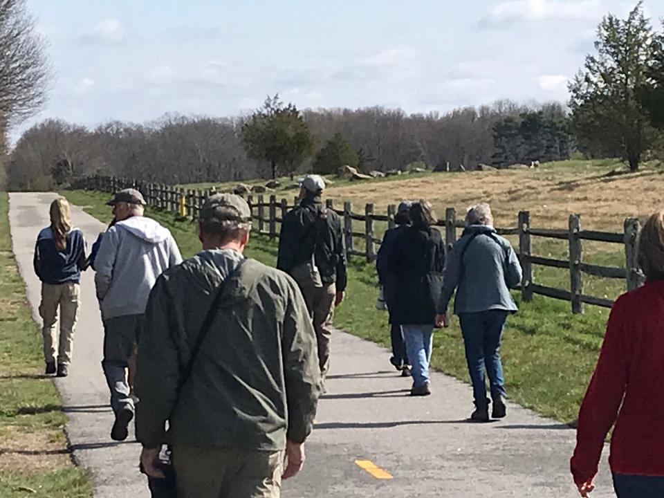 A group of birders follows the paved Calf Pasture Bike Trail in North Kingstown.  