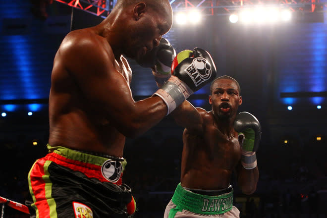 ATLANTIC CITY, NJ - APRIL 28: Chad Dawson (grey and green trunks) lands a punch against Bernard Hopkins (black trunks) during their WBC & Ring Magazine Light Heavyweight Title fight at Boardwalk Hall Arena on April 28, 2012 in Atlantic City, New Jersey. (Photo by Al Bello/Getty Images)