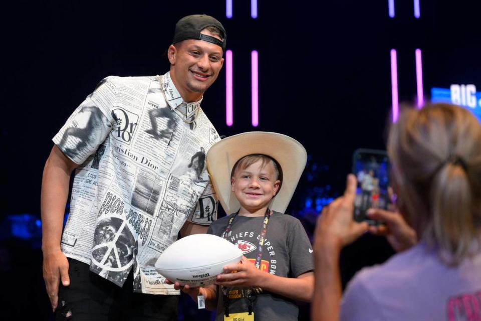 Patrick Mahomes gave an autographed football to a young Children’s Mercy cancer survivor. Mahomes, No. 15, autographed 15 footballs, auctioned for $15,000 apiece.