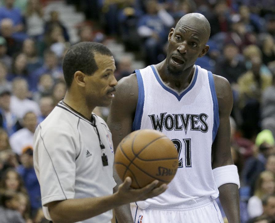 Minnesota Timberwolves forward Kevin Garnett questions referee Eric Lewis after Lewis charged Garnett with a technical foul during the first half of an NBA basketball game against the Memphis Grizzlies in Minneapolis, Saturday, Feb. 28, 2015. (AP Photo/Ann Heisenfelt)