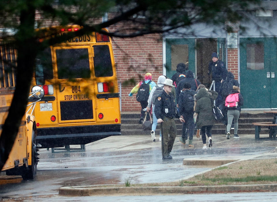 <p>Police move students into a different area of Great Mills High School, the scene of a shooting, Tuesday morning, March 20, 2018 in Great Mills, Md. (Photo: Alex Brandon/AP) </p>