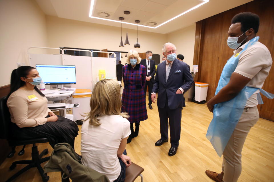 BIRMINGHAM, ENGLAND - FEBRUARY 17: Prince Charles, Prince of Wales and Camilla, Duchess of Cornwall speaks to members of staff during a visit to The Queen Elizabeth Hospital on February 17, 2021 in Birmingham, England. (Photo by Molly Darlington - WPA Pool/Getty Images)