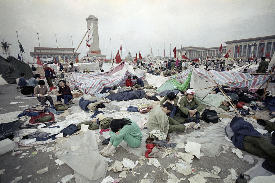 FILE - In this May 28, 1989 file photo, students rest in the litter of Tiananmen Square in Beijing, as their strike for government reform enters its third week. Thirty years since the Tiananmen Square protests, China's economy has catapulted up the world rankings, yet political repression is harsher than ever. (AP Photo/Jeff Widener, File)