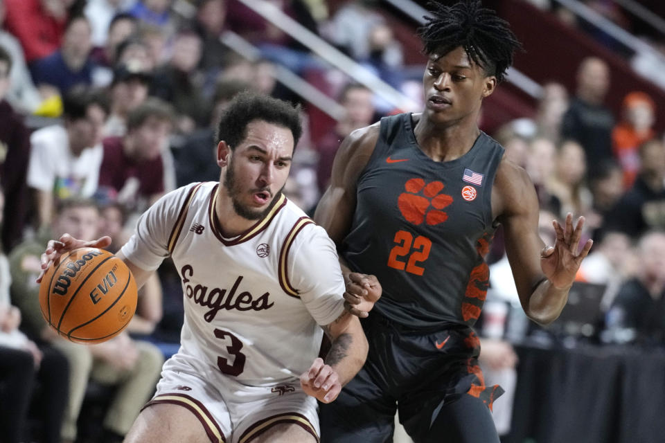 Boston College guard Jaeden Zackery (3) drives to the basket against Clemson forward RJ Godfrey (22) during the second half of an NCAA college basketball game, Tuesday, Jan. 31, 2023, in Boston. (AP Photo/Charles Krupa)