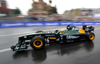 Formula One Team Lotus driver Karun Chandhok of India drives past St. Basils cathedral during the "Moscow City Racing" show on July 17, 2011 in central Moscow. AFP PHOTO / NATALIA KOLESNIKOVA (Photo credit should read NATALIA KOLESNIKOVA/AFP/Getty Images)