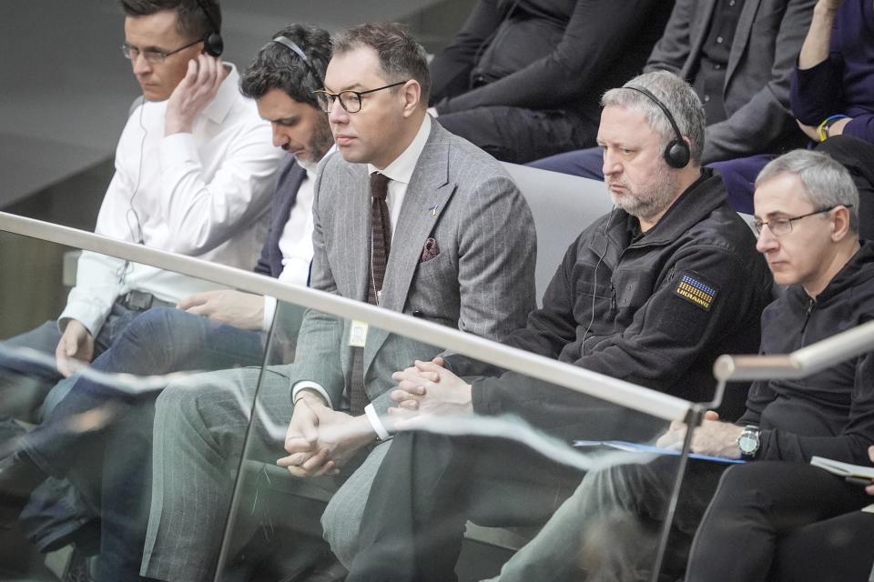 Ambassador of Ukraine to Germany Oleksiy Makeyev, third from left, follows the debate in the Bundestag, Berlin, Thursday, Feb. 22, 2024. German lawmakers on Thursday approved a motion calling on the government to deliver “further necessary long-range weapons systems and ammunition” to Ukraine, but voted down an opposition call explicitly to send Taurus long-range cruise missiles. (Michael Kappeler/dpa via AP)