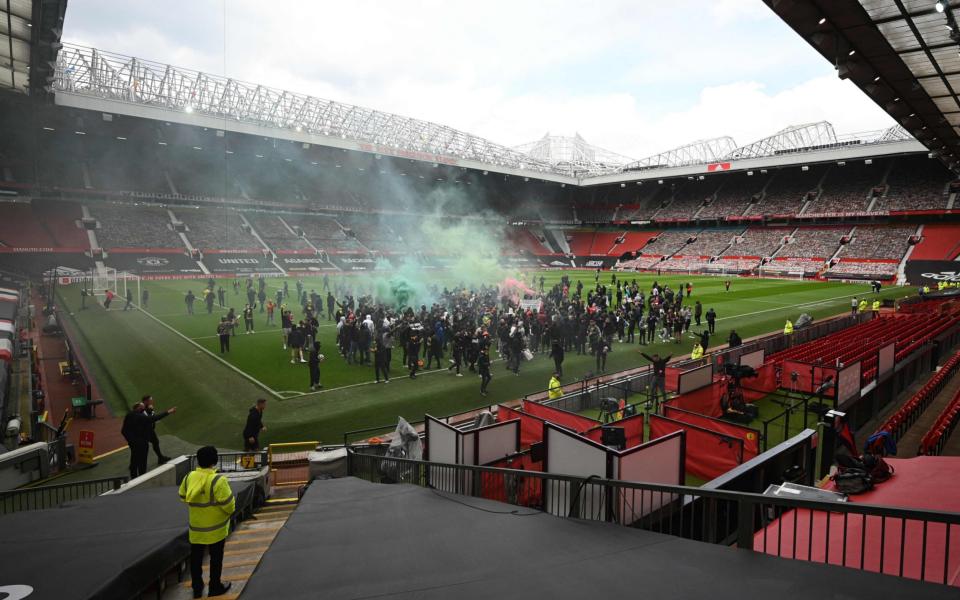 Supporters protest against Manchester United's owners, inside English Premier League club Manchester United's Old Trafford stadium in Manchester - OLI SCARFF /AFP 