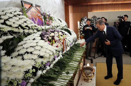 South Korean President Moon Jae-in mourns at the funeral of former South Korean "comfort woman" Kim Bok-dong in Seoul, South Korea, January 29, 2019. Yonhap via REUTERS