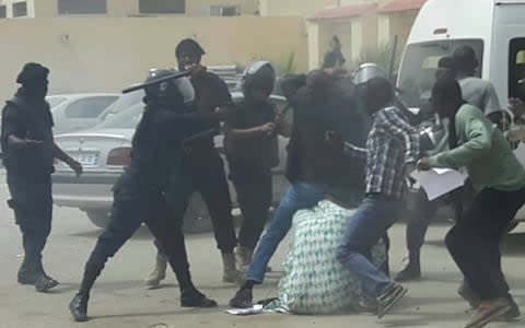 Video still of police beating protesters in Mauritania - Credit: Telegraph