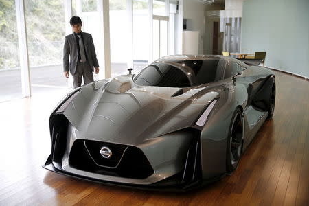 Tsutomu Yamaguchi, General Manager of Color Design Department, Global Design Center, stands next to Nissan Concept 2020 Vision Gran Turismo at the company's Global Design Center in Atsugi, Japan, April 14, 2016. REUTERS/Toru Hanai