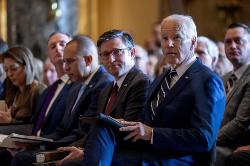 President Joe Biden (R) attends the National Prayer Breakfast in Statuary Hall of the U.S. Capitol in Washington on Thursday. Biden is seated next to Speaker of the House Mike Johnson, R-La. Every U.S. president since Dwight Eisenhower in 1953 has attended the annual breakfast. Photo by Shawn Thew/UPI