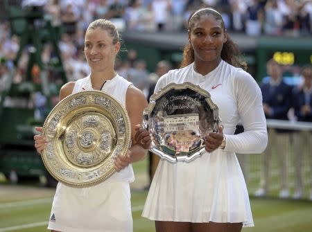 Jul 14, 2018; London, United Kingdom; Serena Williams (USA) and Angelique Kerber (GER) pose with their trophies on day 12 at All England Lawn and Croquet Club. Mandatory Credit: Susan Mullane-USA TODAY Sports